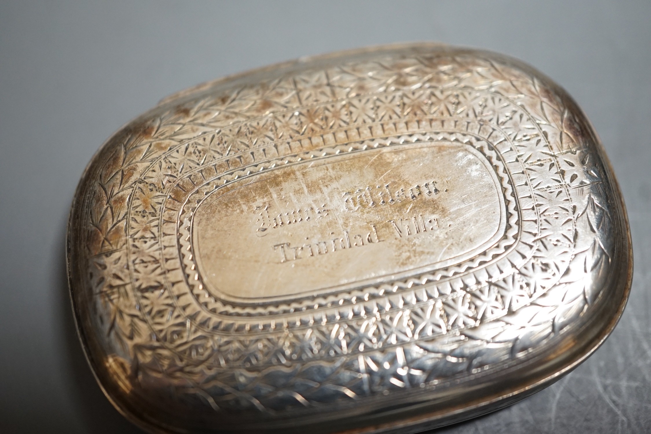 A Victorian Scottish silver oval vesta case, John Muirhead & Son, Glasgow, 1869, with engraved inscription and cover with hunting dog and game bird, 58mm.